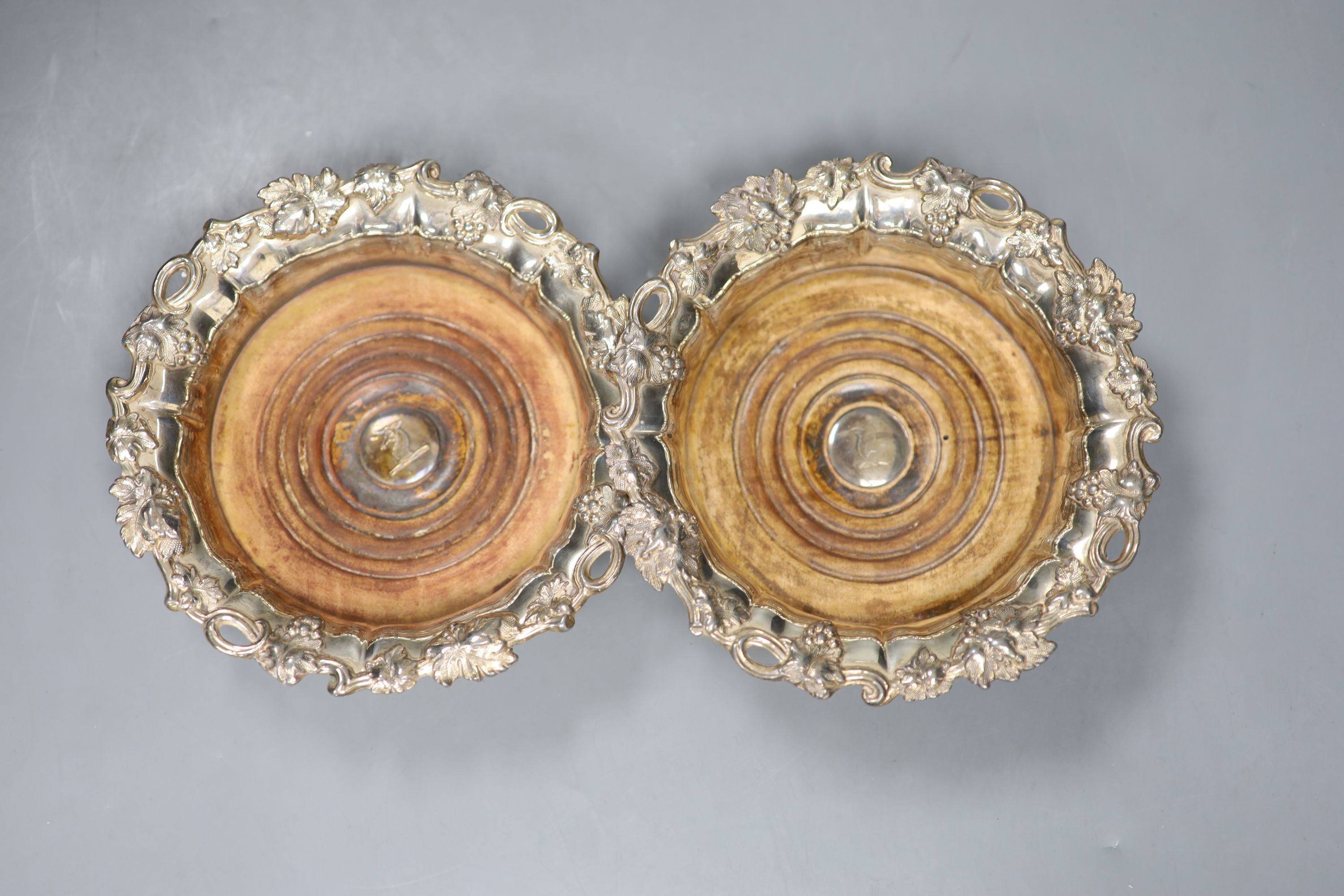 A pair of 19th century plated wine coasters. 17cm